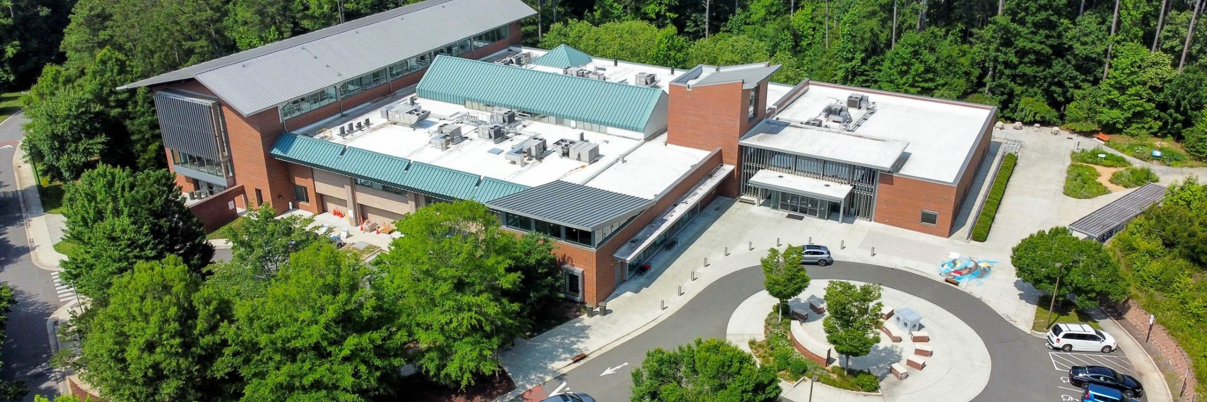 Aerial photo of the Chapel Hill Public Library building and surrounding trees