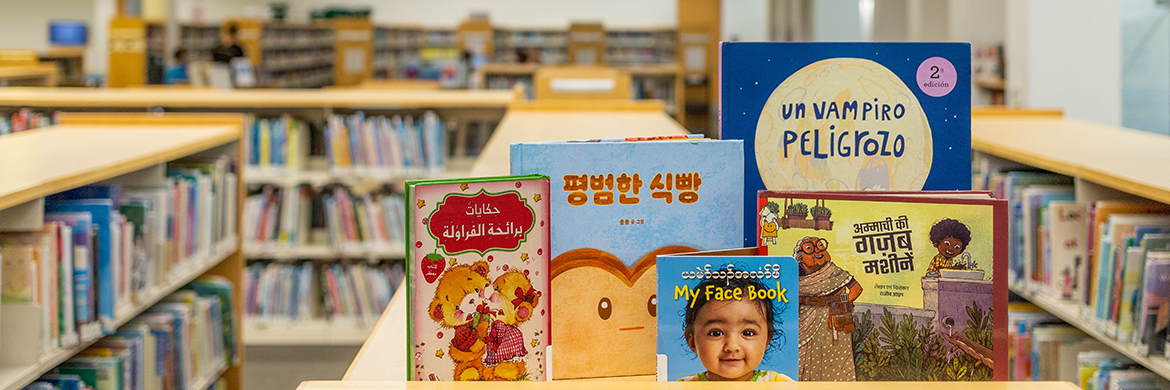 Children's book display with books in different languages